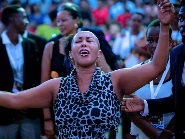 Festival of miracles in Bujumbura Burundi as seen in the photo a woman raises her hands praising God